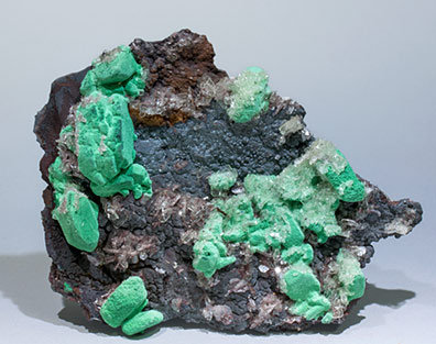 Malachite after Azurite with Baryte and Goethite.