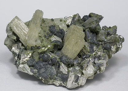 Fluorapatite with Arsenopyrite, Chlorite and Quartz.