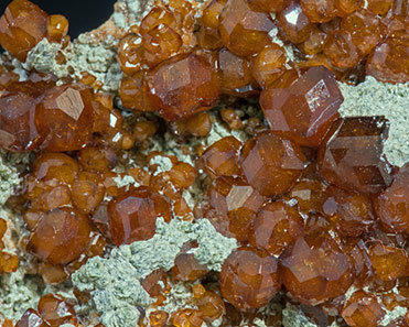 Grossular (variety hessonite) with Chlorite. 