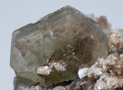 Fluorapatite with inclusions and Muscovite. 