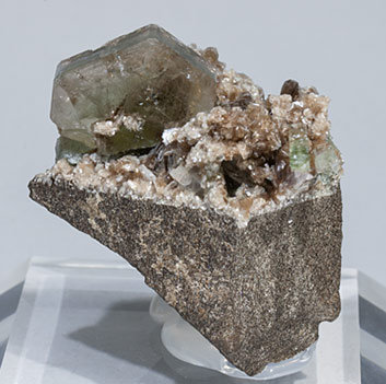 Fluorapatite with inclusions and Muscovite.