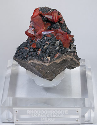 Rhodochrosite with manganese oxides. 