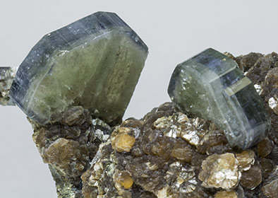 Fluorapatite with Quartz, Muscovite and Siderite. 