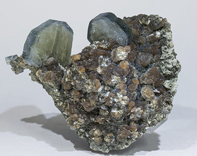 Fluorapatite with Quartz, Muscovite and Siderite.