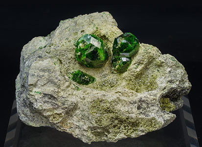 Andradite (variety demantoid) with Diopside.