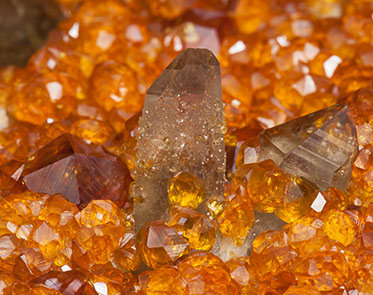 Spessartine with Quartz (variety smoky). 