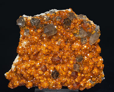 Spessartine with Quartz (variety smoky). 