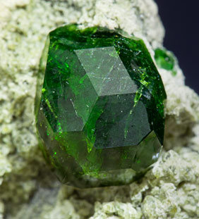 Andradite (variety demantoid) with Diopside. 