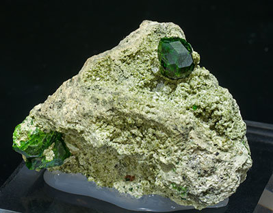 Andradite (variety demantoid) with Diopside. 