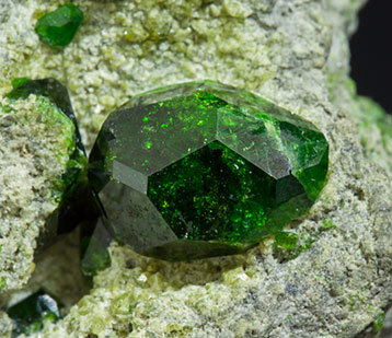 Andradite (variety demantoid) with Diopside. 