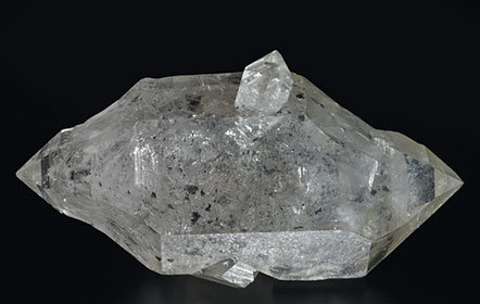 Quartz (doubly terminated) with hydrocarbon inclusions.