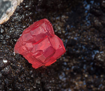 Rhodochrosite with manganese oxides. 