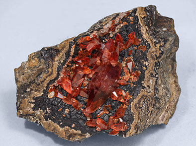Rhodochrosite with manganese oxides. Side