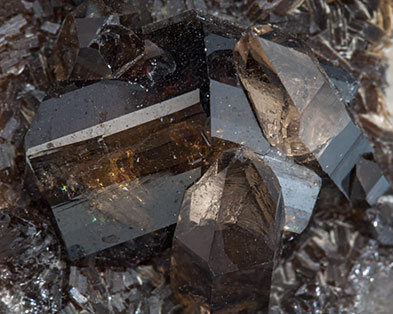 Cassiterite with Muscovite and Quartz (variety smoky). 