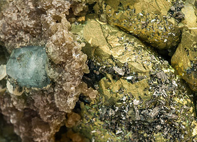 Chalcopyrite with Arsenopyrite, Fluorapatite, Siderite and Muscovite. 