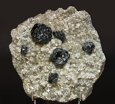 Cassiterite with Muscovite. Side