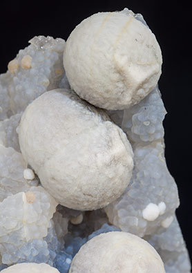 Calcite on Quartz (variety chalcedony). 