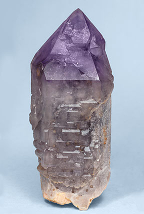 Quartz (variety amethyst) on Quartz (variety smoky) and Microcline.