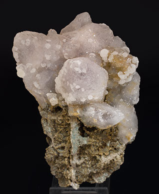 Quartz with Calcite and Siderite.