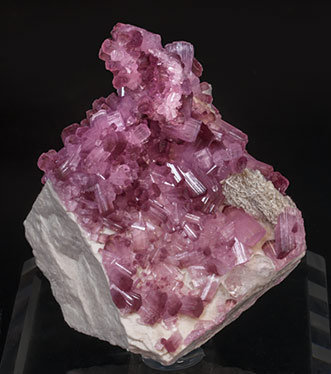 Elbaite (variety rubellite) with Feldspar.