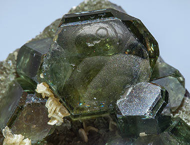 Fluorapatite with Ferberite, Siderite and Muscovite. 