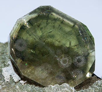Fluorapatite with Ferberite, Siderite, Muscovite and Pyrite. 