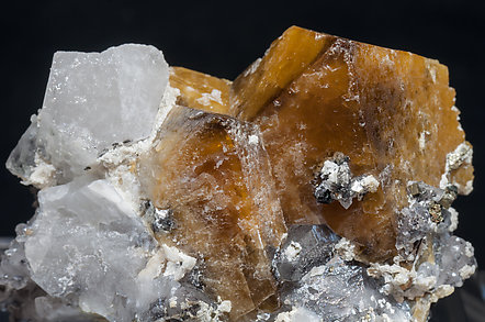Scheelite with Quartz, Ferberite, Cassiterite, Pyrite and Mica. 