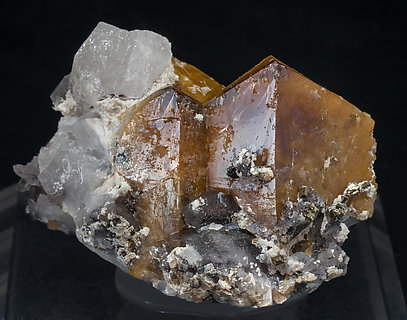 Scheelite with Quartz, Ferberite, Cassiterite, Pyrite and Mica. 