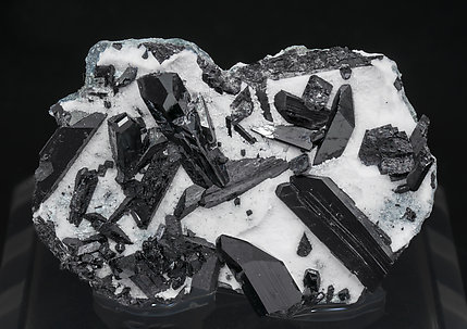 Neptunite and Natrolite. 