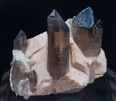 Quartz (variety smoky) with Microcline and Albite. Front