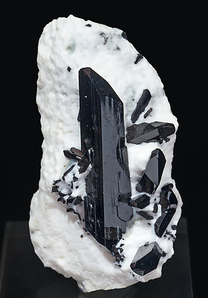 Neptunite on Natrolite.