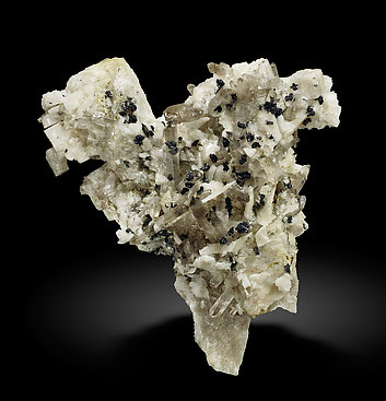 Pyrophanite with Feldspar and Quartz (variety smoky). 