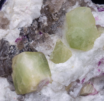 Rb-rich Rhodizite with Elbaite (variety rubellite), Quartz and Feldspar. 