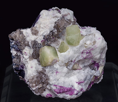 Rb-rich Rhodizite with Elbaite (variety rubellite), Quartz and Feldspar.