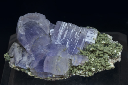 Fluorapatite with Muscovite and Chlorite.