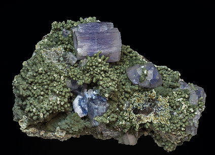 Fluorapatite with Muscovite, Chlorite, Pyrite and Quartz.