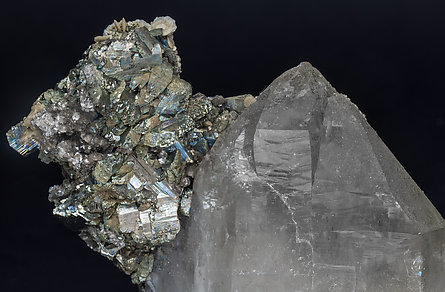 Quartz with Arsenopyrite, Marcasite, Siderite, Calcite and Muscovite. 
