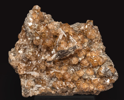 Grossular (variety hessonite) with Pectolite. 
