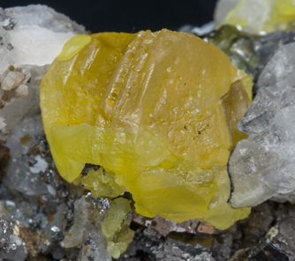 Sphalerite with Calcite, Quartz, Arsenopyrite and Sphalerite. 