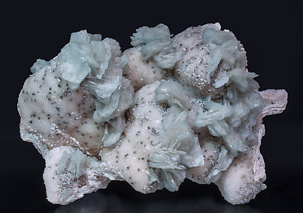 Baryte with Rhodochrosite epimorphic on Calcite.