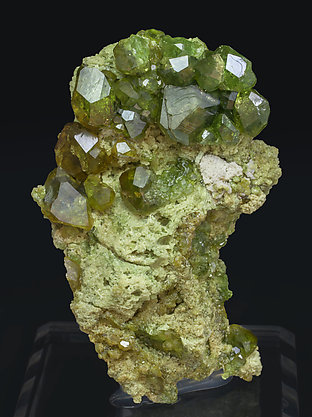 Andradite (variety demantoid) with Calcite.