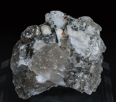 Bavenite with Quartz (variety smoky), Helvine and Feldspar.