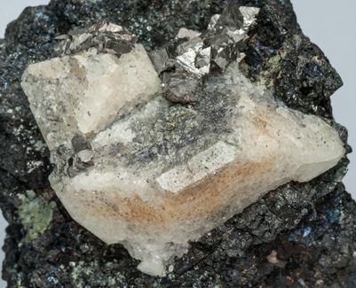 Scheelite with Molybdenite, Arsenopyrite and Magnetite. 