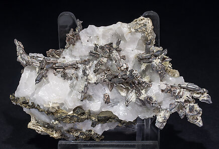 Allargentum with Actinolite (variety byssolite) and Calcite.