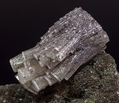 Fluorapatite with Quartz, Arsenopyrite, Muscovite and Chlorite. 