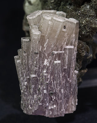 Fluorapatite with Quartz, Arsenopyrite, Muscovite and Chlorite. 