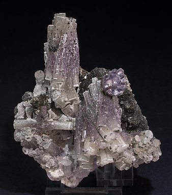 Fluorapatite with Muscovite, Chlorite, Quartz and Arsenopyrite.