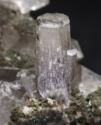 Fluorapatite with Quartz, Sphalerite, Muscovite and Chlorite. 