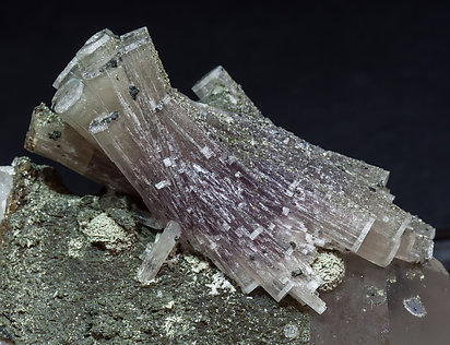 Fluorapatite with Quartz, Muscovite and Chlorite. 