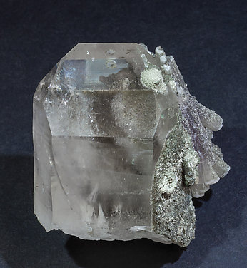 Fluorapatite with Quartz, Muscovite and Chlorite.